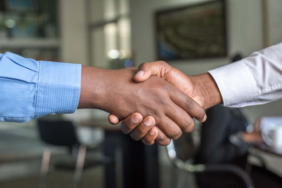 Two business partners shaking hands after a corporate agreement